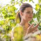 woman touching plant green house_23 2148068649 85x85